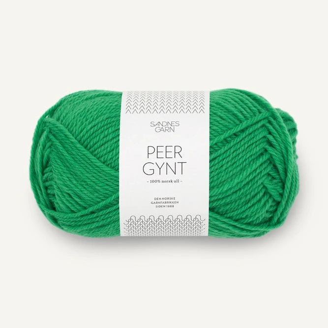 Jelly Bean Green skein of Sandnes Garn Peer Gynt with a label on a white background