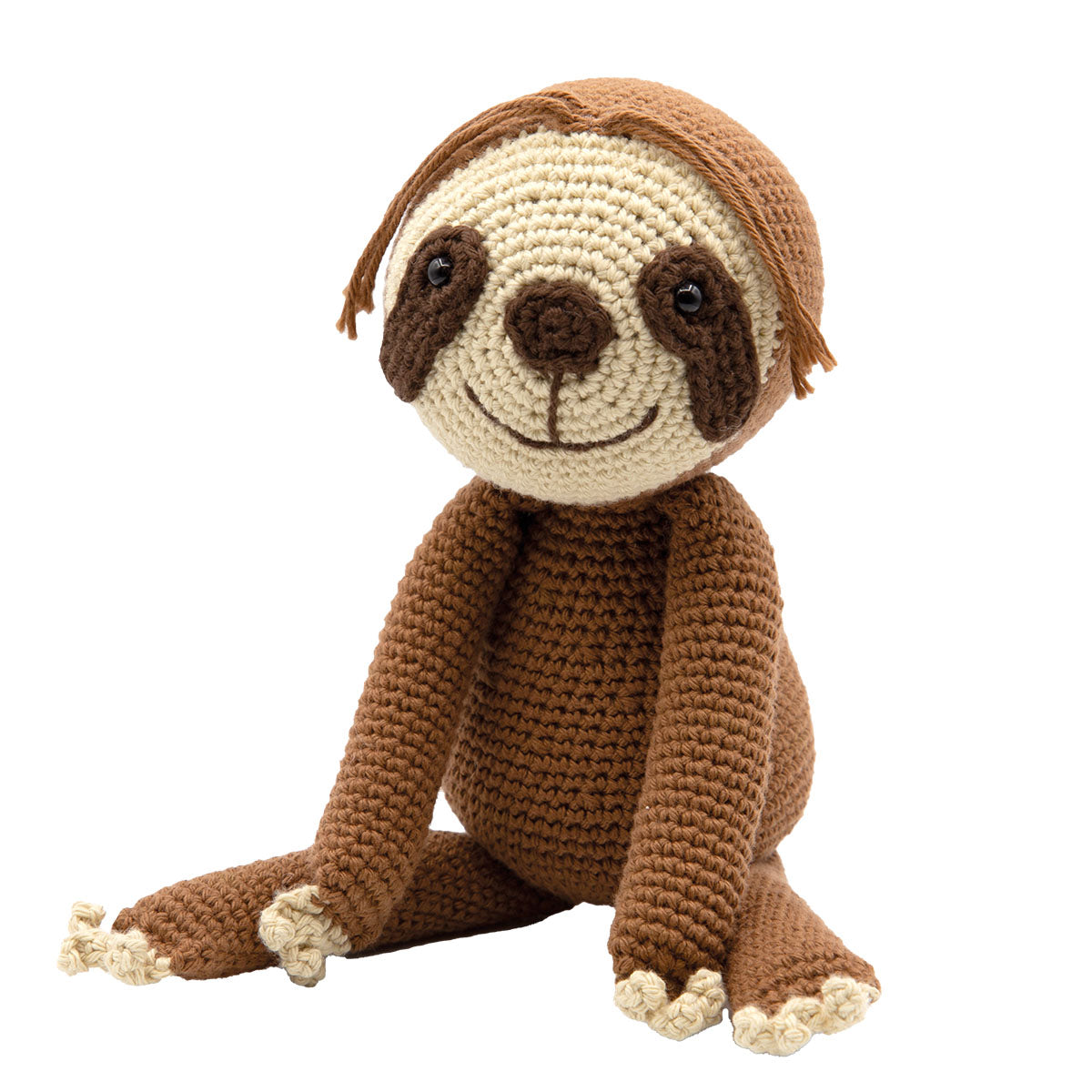 Hand-crocheted sloth toy sitting with legs forward, made from brown and cream yarn, isolated on a white background