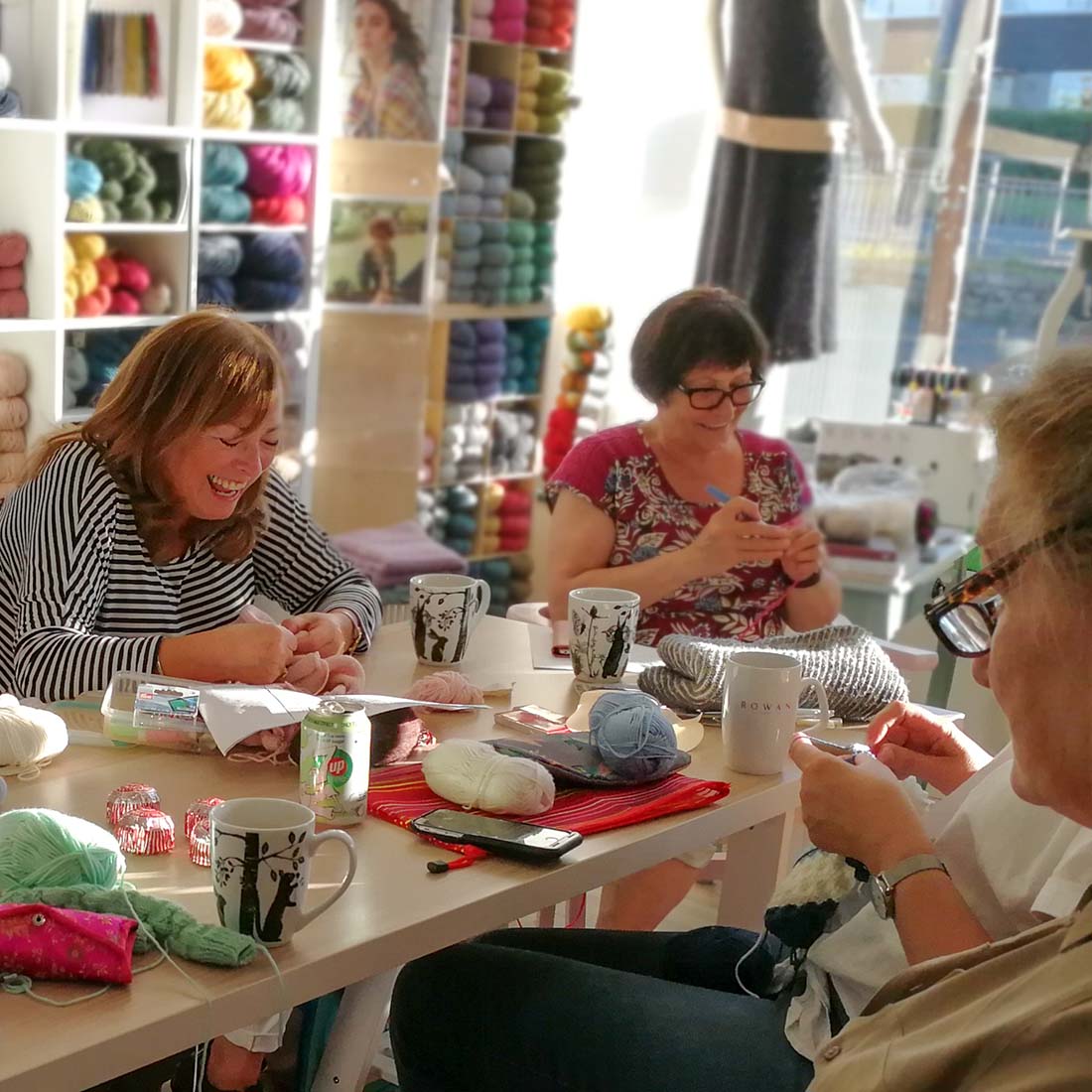 Women having fun and laughing at a knitting class at The Orry Mill