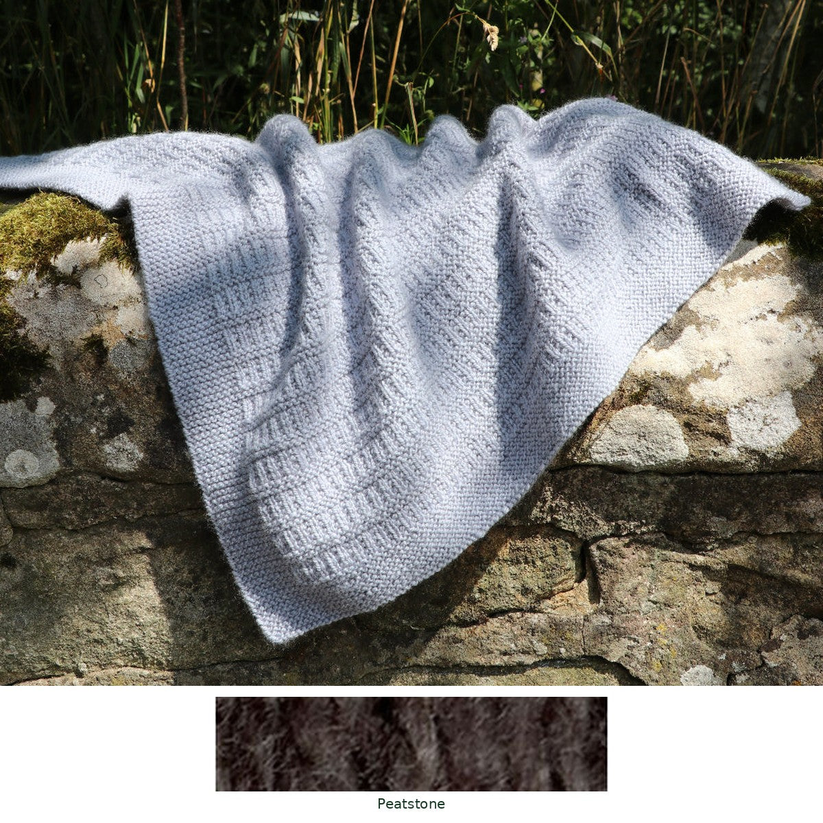 Cassillis Baby Blanket knitting kit in Peatstone, with the yarn shade shown