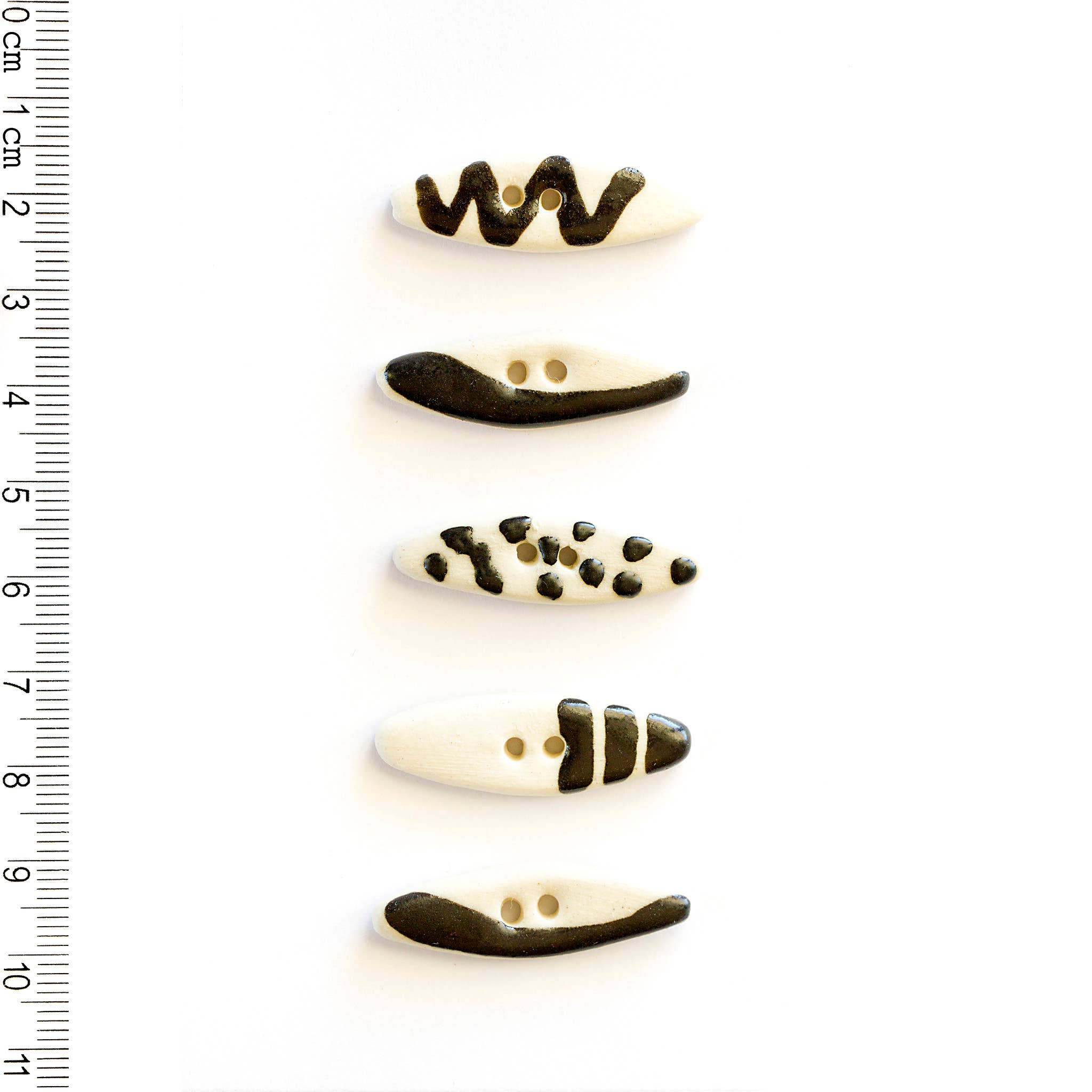 Boutons incomparables - 5 boutons ovales à motifs géométriques