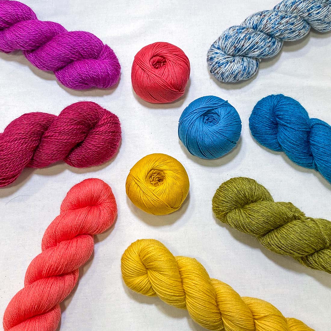 Colourful selection of yarn balls and hanks in cotton and wool